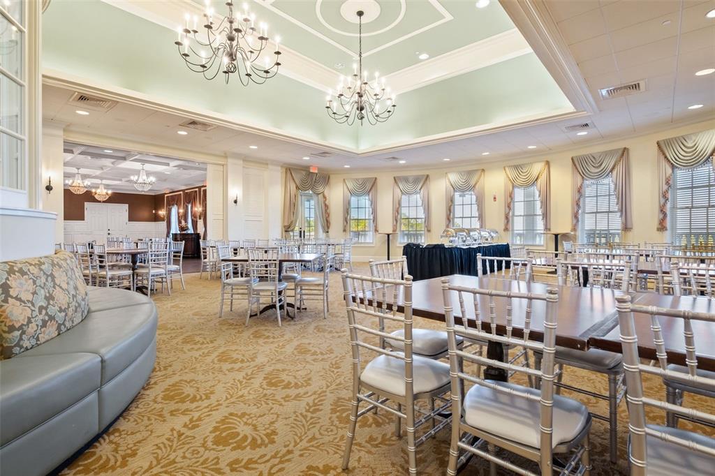 4661 Southern Valley Loop Brooksville, FL 34601 - Photo 61 of 62 a living room with furniture a chandelier and a large window