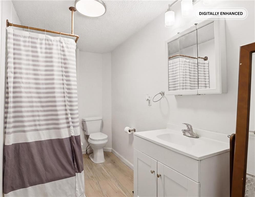 132 Waterloo Street Friedens, PA 15541 - Photo 14 of 47 a bathroom with a sink a toilet and shower curtain