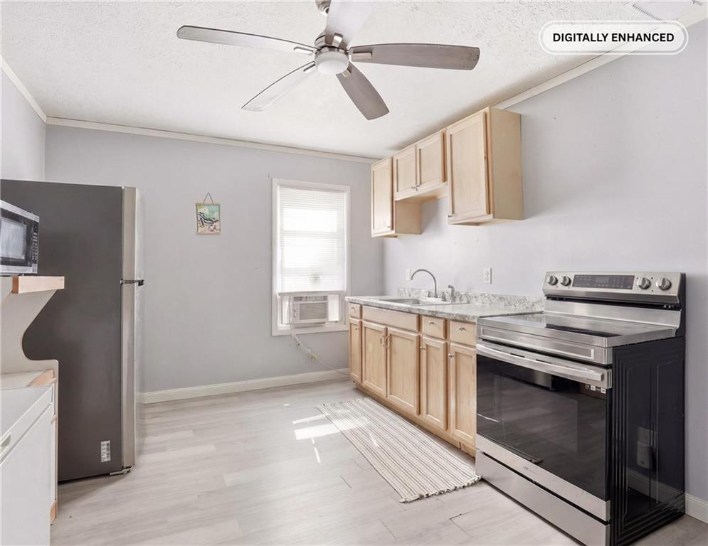 132 Waterloo Street Friedens, PA 15541 - Photo 19 of 47 a kitchen with stainless steel appliances a stove a sink and a refrigerator