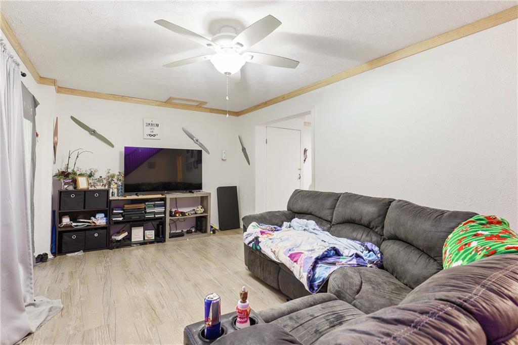 132 Waterloo Street Friedens, PA 15541 - Photo 27 of 47 a living room with furniture and a flat screen tv