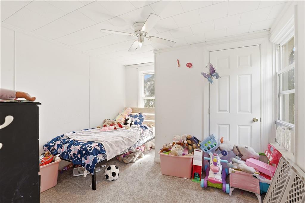 132 Waterloo Street Friedens, PA 15541 - Photo 29 of 47 a bedroom with bed and a chandelier