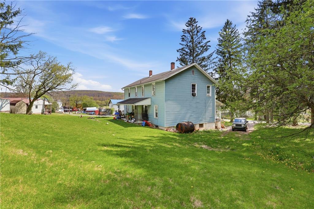 132 Waterloo Street Friedens, PA 15541 - Photo 6 of 47 a front view of a house with a yard and trees
