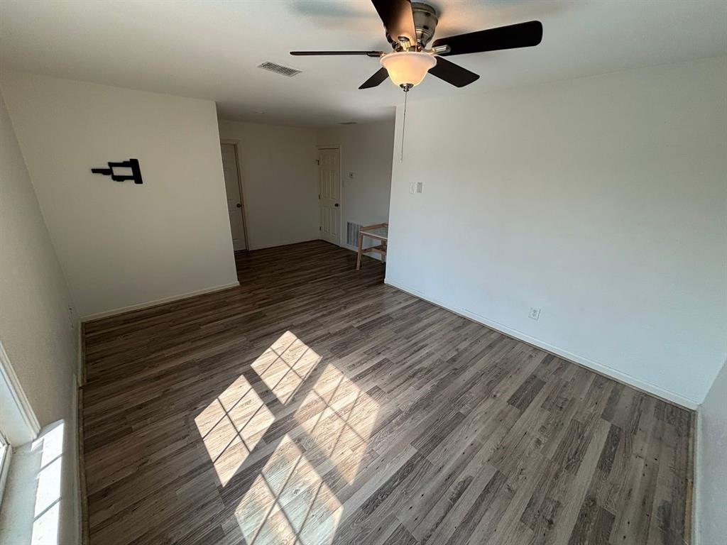 2113 Via Del Norte Carrollton, TX 75006 - Photo 13 of 24 a view of empty room with wooden floor