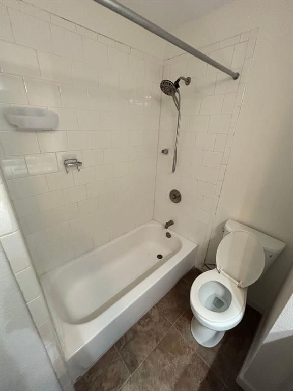 2113 Via Del Norte Carrollton, TX 75006 - Photo 17 of 24 a bathroom with a toilet and a shower