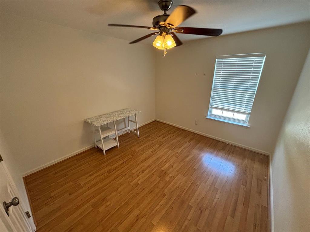 2113 Via Del Norte Carrollton, TX 75006 - Photo 18 of 24 wooden floor in an empty room with a window