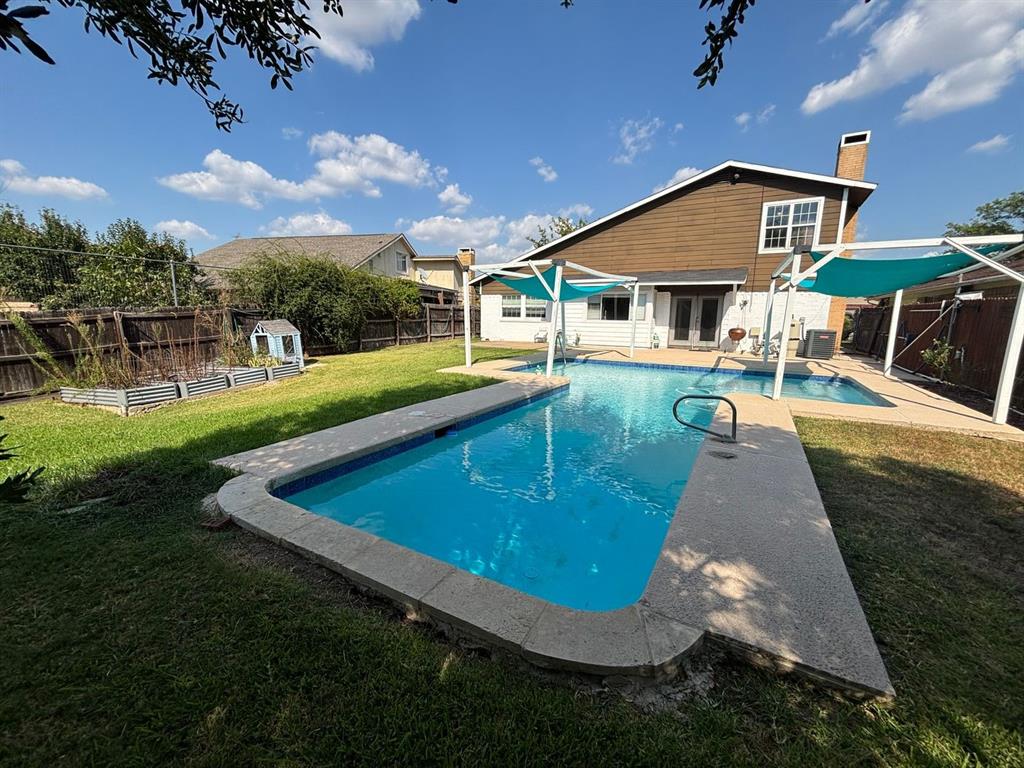 2113 Via Del Norte Carrollton, TX 75006 - Photo 23 of 24 a view of a house with swimming pool