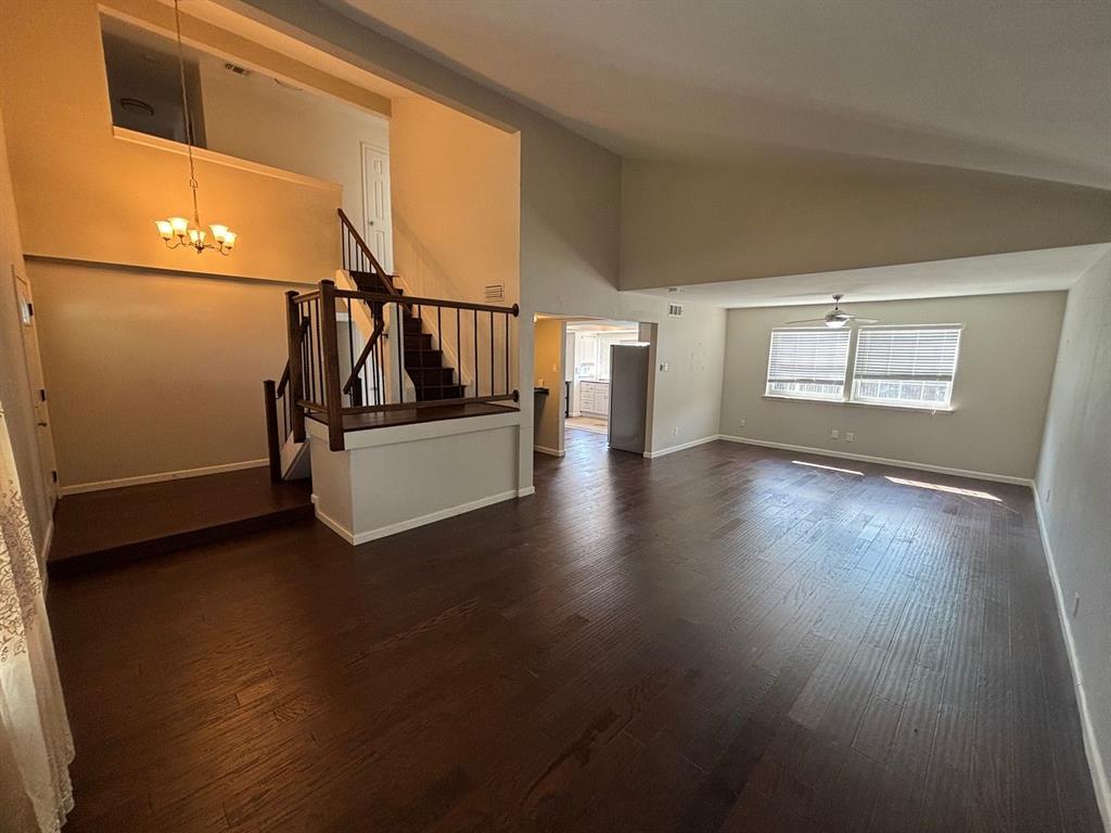 2113 Via Del Norte Carrollton, TX 75006 - Photo 4 of 24 a view of empty room with wooden floor and fan