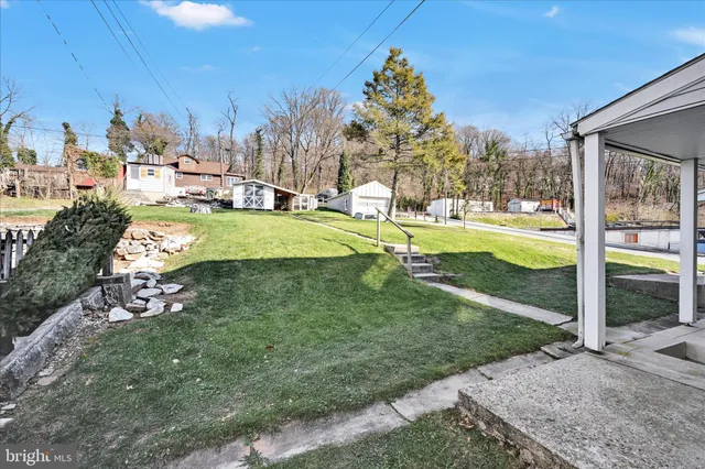 a view of a fountain in front of a house