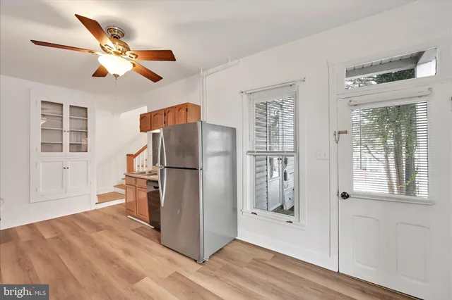 a kitchen with stainless steel appliances a refrigerator and cabinets
