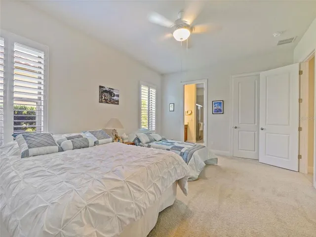 a view of a livingroom with furniture and a bookshelf