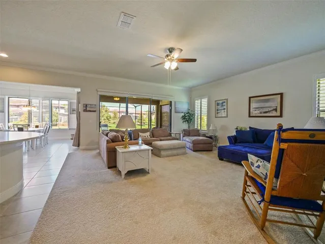 a view of a livingroom with workspace and a window