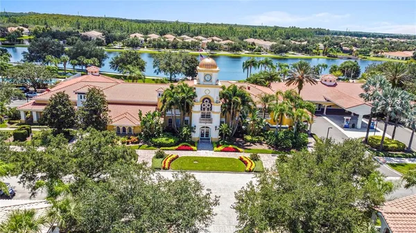 an aerial view of a house with a lake view