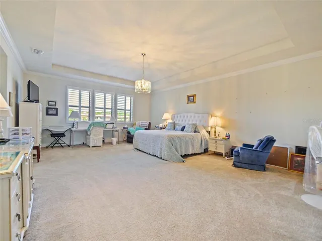 an aerial view of a house with a swimming pool yard and outdoor seating