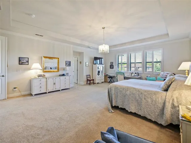 an aerial view of a house with a lake view