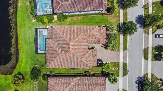an aerial view of residential houses with outdoor space