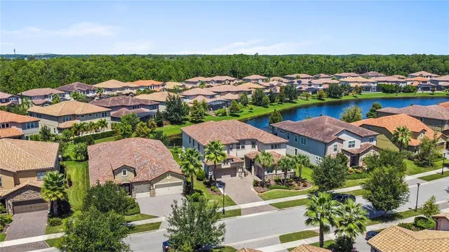 a view of a livingroom with wooden floor and stairs
