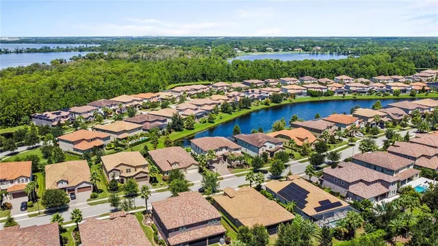 a view of a dining room with furniture and a chandelier