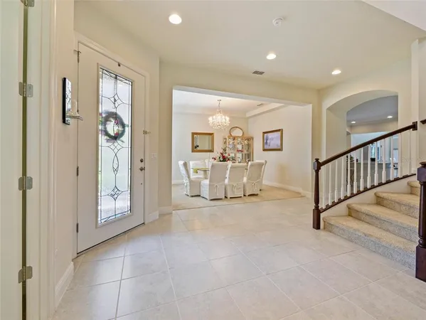 a view of a hallway with a livingroom and entryway