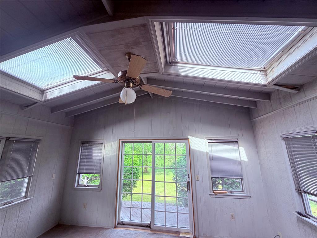 5963 Valley Road Slatington, PA 18080 - Photo 17 of 20 Natural light floods this inviting room through multiple skylights and a wide glass door.