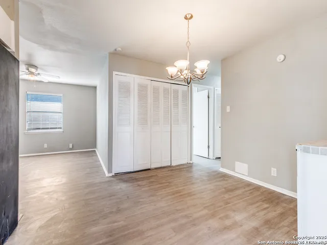 a view of a chandelier with wooden floor