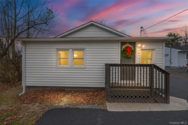 a front view of a house with a garage