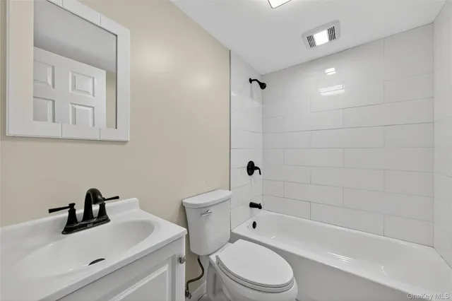 a bathroom with a sink toilet a bathtub and shower