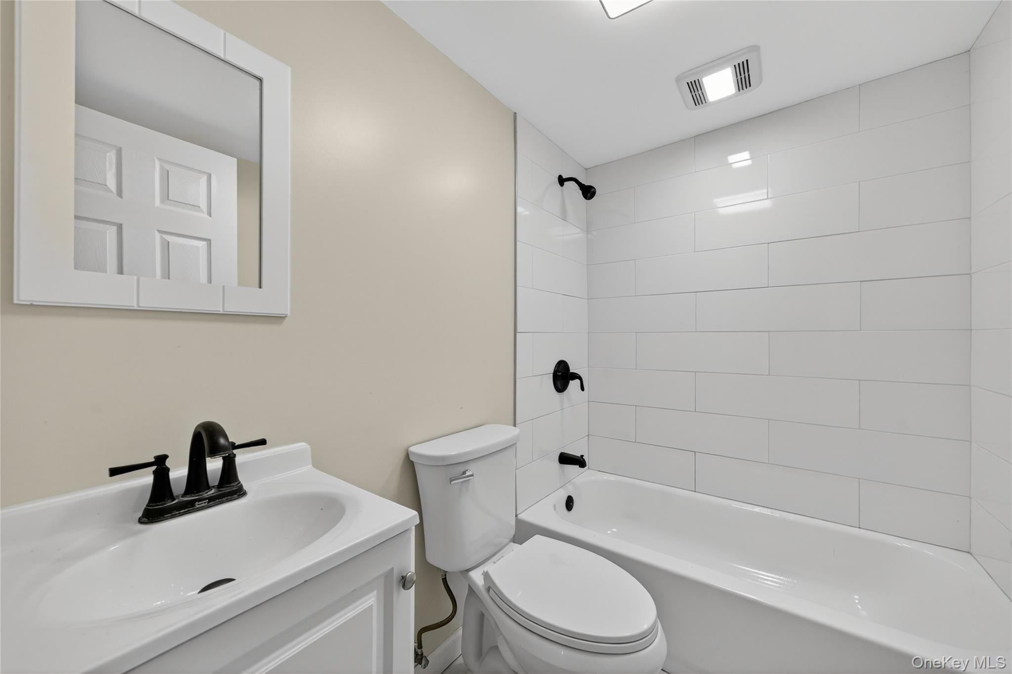 193 Schutt Road Middletown, NY 10940 - Photo 14 of 20 a bathroom with a sink toilet a bathtub and shower