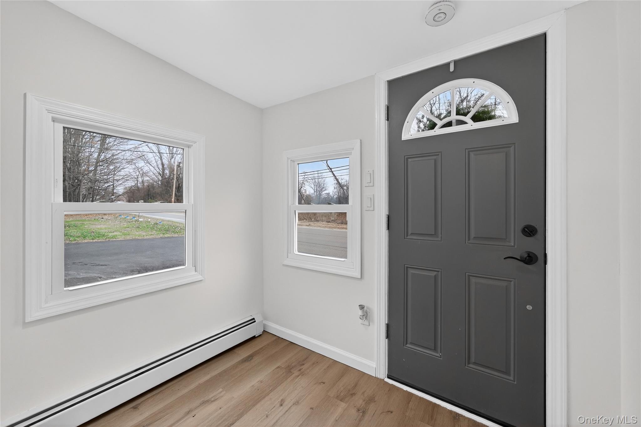 193 Schutt Road Middletown, NY 10940 - Photo 3 of 20 an empty room with wooden floor closet and windows