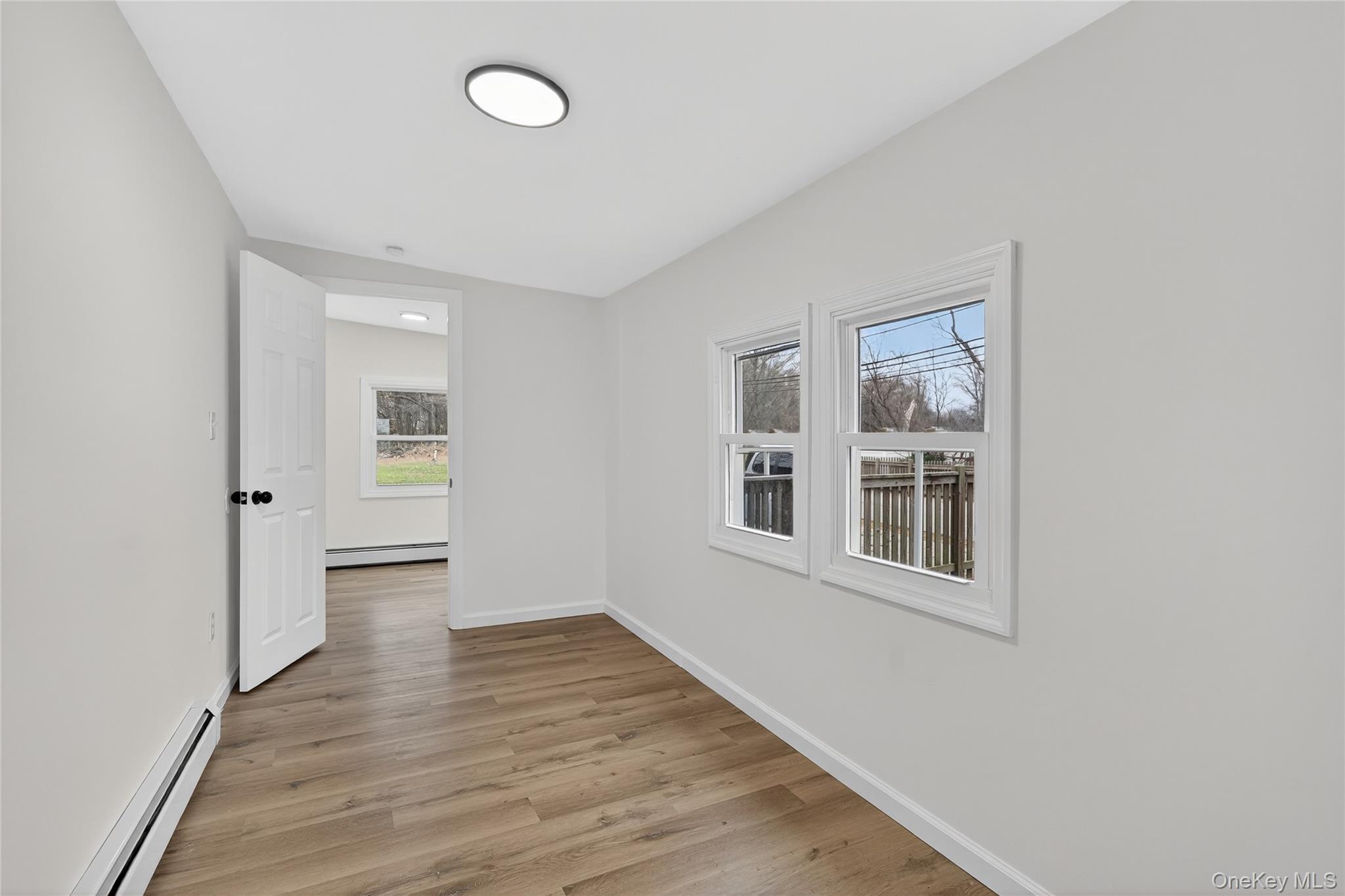 193 Schutt Road Middletown, NY 10940 - Photo 5 of 20 a view of empty room with wooden floor and fan