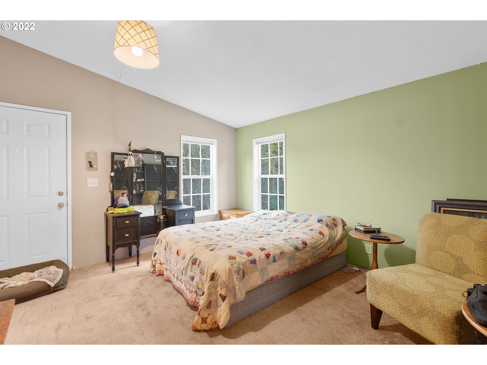 121 Brentwood Road Longview, WA 98632 - Photo 24 of 32 a bedroom with a bed and wooden floor