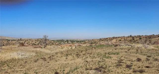 a view of a large building with a mountain in the background