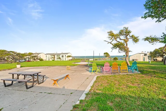 a view of swimming pool with outdoor seating and yard