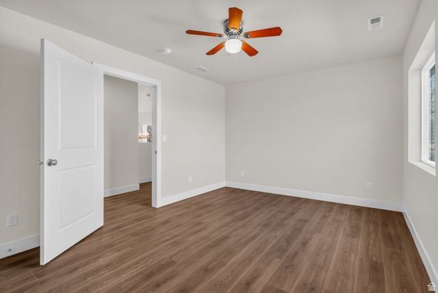 578 West 7th Midvale, UT 84047 - Photo 12 of 35 Empty room featuring ceiling fan and dark wood-style floors