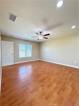 a view of hallway with wooden floor