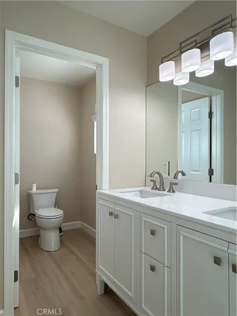 a kitchen with stainless steel appliances kitchen island granite countertop a stove and a sink