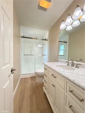 a view of washer and dryer with kitchen in the background
