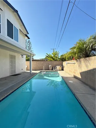 an aerial view of a house with outdoor space