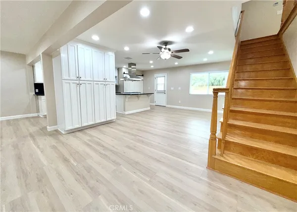 a kitchen with stainless steel appliances granite countertop a stove and a refrigerator
