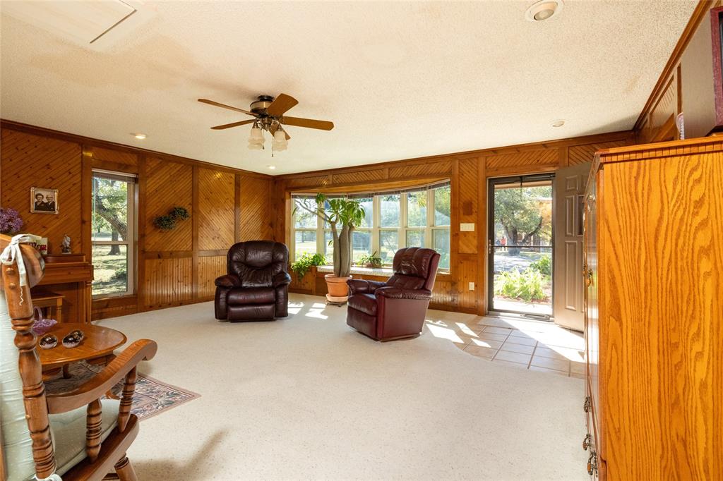 970 Live Oak Road Santo, TX 76472 - Photo 16 of 40 a living room with furniture and a large window