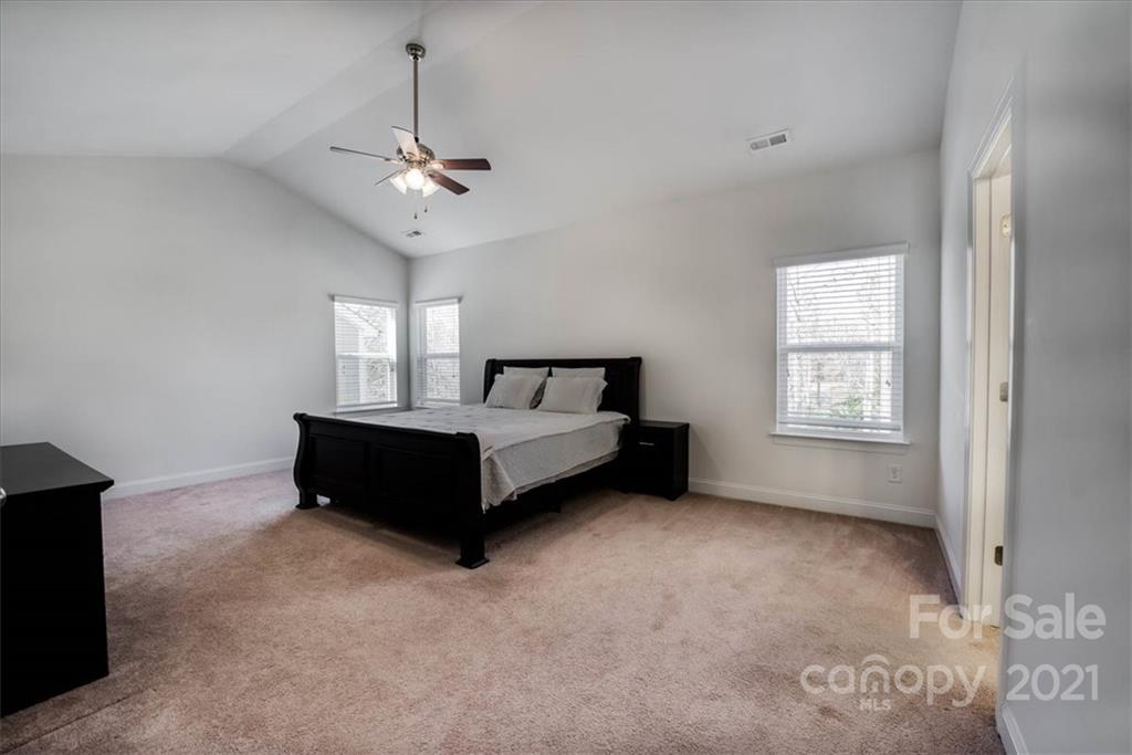 4008 Fallondale Road Waxhaw, NC 28173 - Photo 23 of 44 a spacious bedroom with a bed dresser and a window