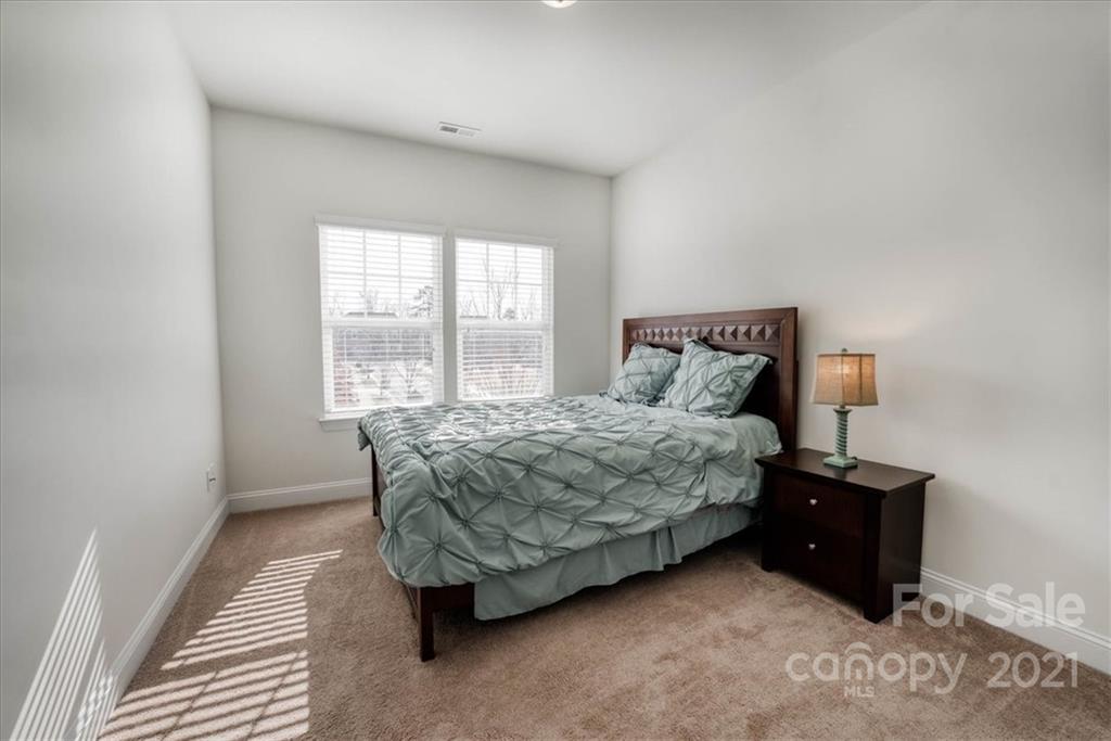 4008 Fallondale Road Waxhaw, NC 28173 - Photo 33 of 44 a bedroom with a bed and a window