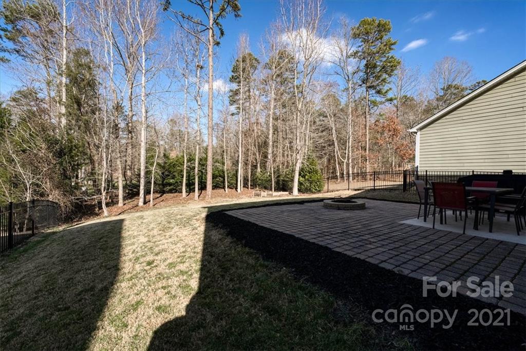 4008 Fallondale Road Waxhaw, NC 28173 - Photo 36 of 44 a view of a roof deck with table and chairs with wooden floor and fence