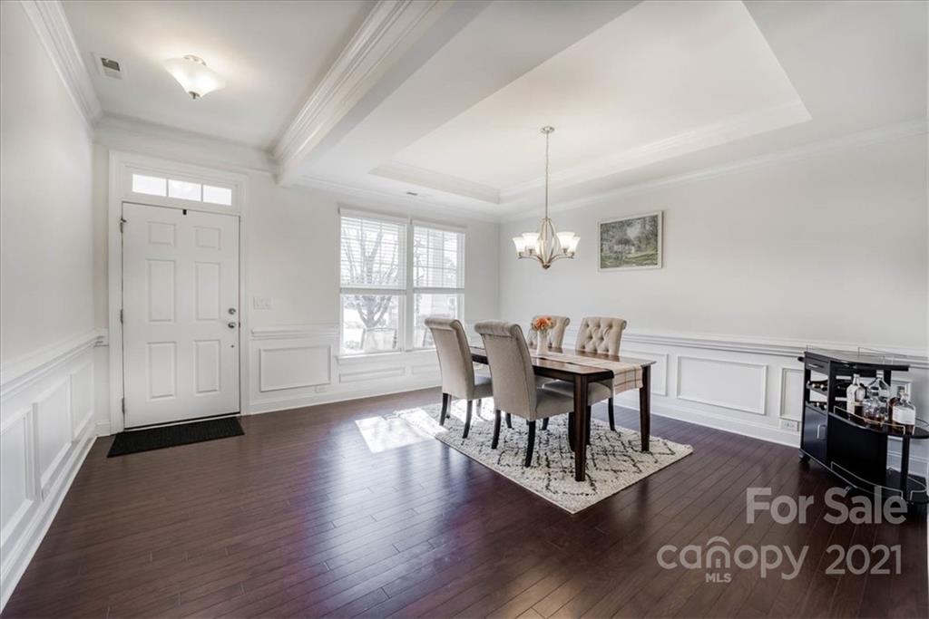 4008 Fallondale Road Waxhaw, NC 28173 - Photo 8 of 44 a view of a dining room with furniture and wooden floor