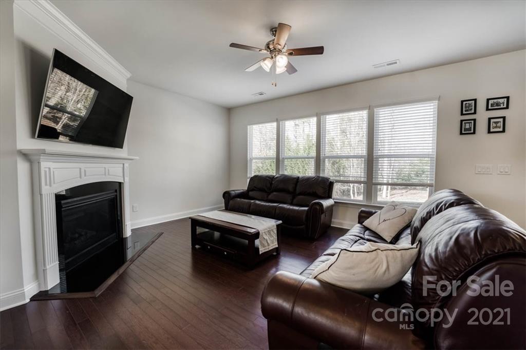 4008 Fallondale Road Waxhaw, NC 28173 - Photo 10 of 44 a living room with furniture fireplace and flat screen tv