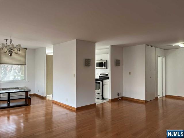 200 Grand Cove Way, Unit 2A Edgewater, NJ 07020 - Photo 4 of 12 a view of empty room with wooden floor