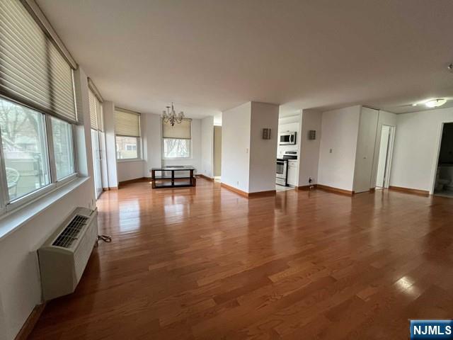 200 Grand Cove Way, Unit 2A Edgewater, NJ 07020 - Photo 5 of 12 a view of a livingroom with furniture wooden floor and a window