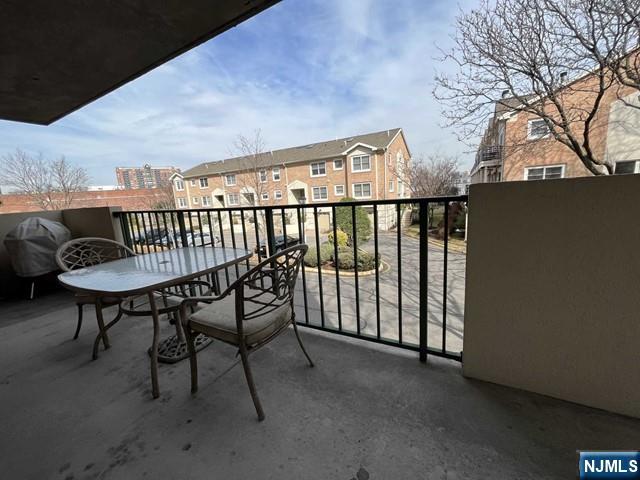200 Grand Cove Way, Unit 2A Edgewater, NJ 07020 - Photo 10 of 12 a view of a chairs and table in the balcony