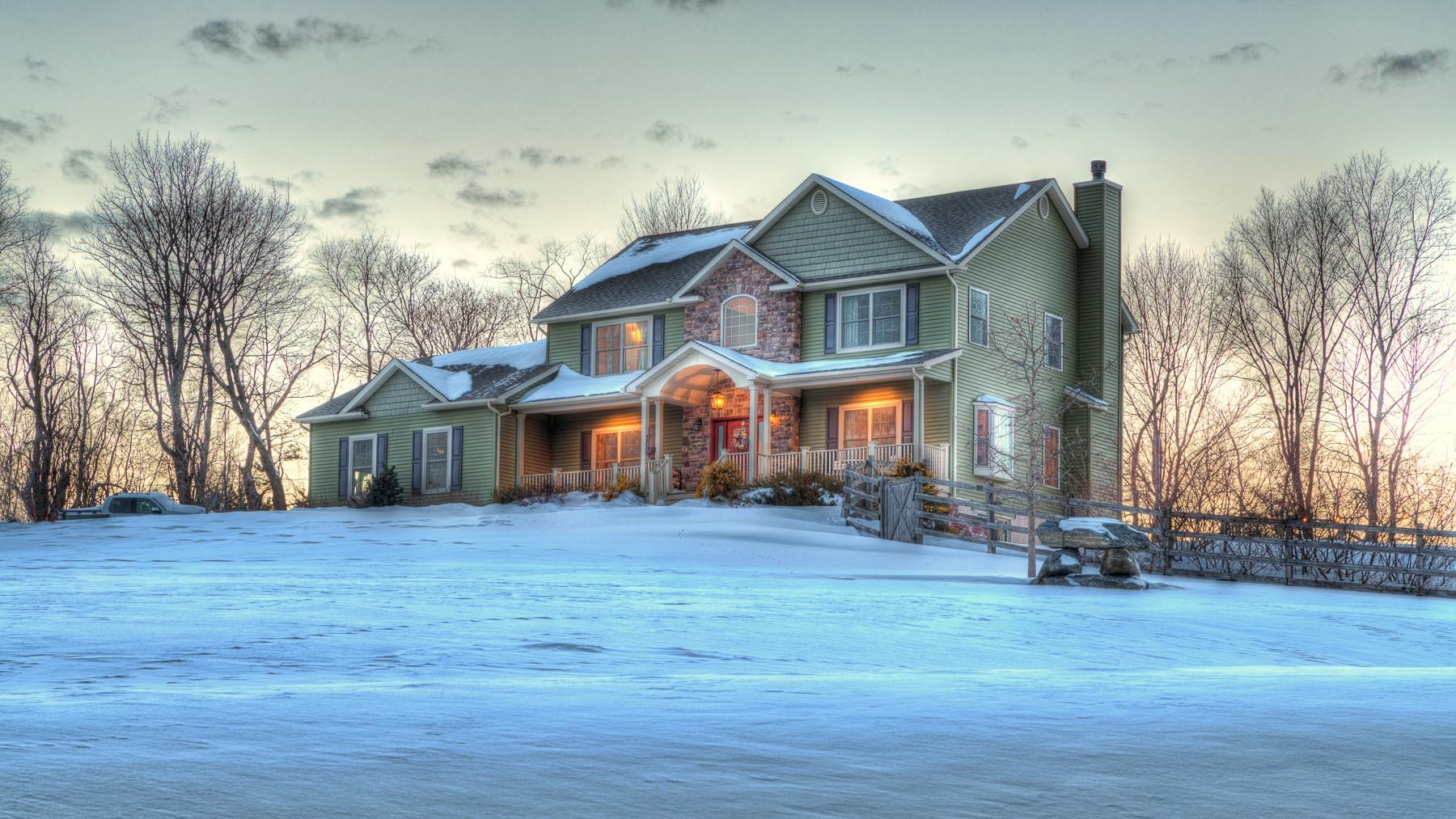 Colonial style home featuring a porch