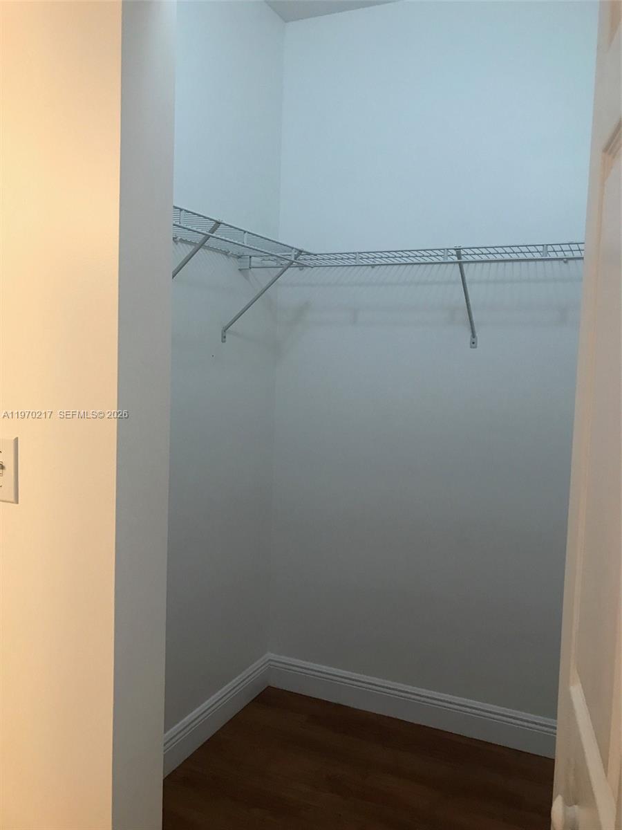 2030 Douglas Road, Unit 708 Coral Gables, FL 33134 - Photo 7 of 8 a view of a room with racks on the wall