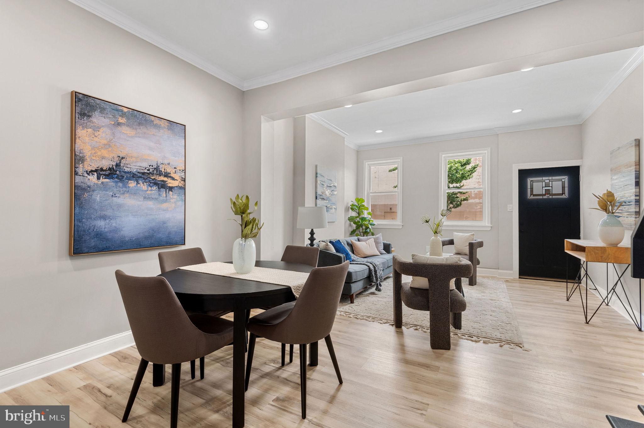 a view of a dining room with furniture window and wooden floor
